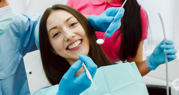 A girl smiling while doing dental checkup